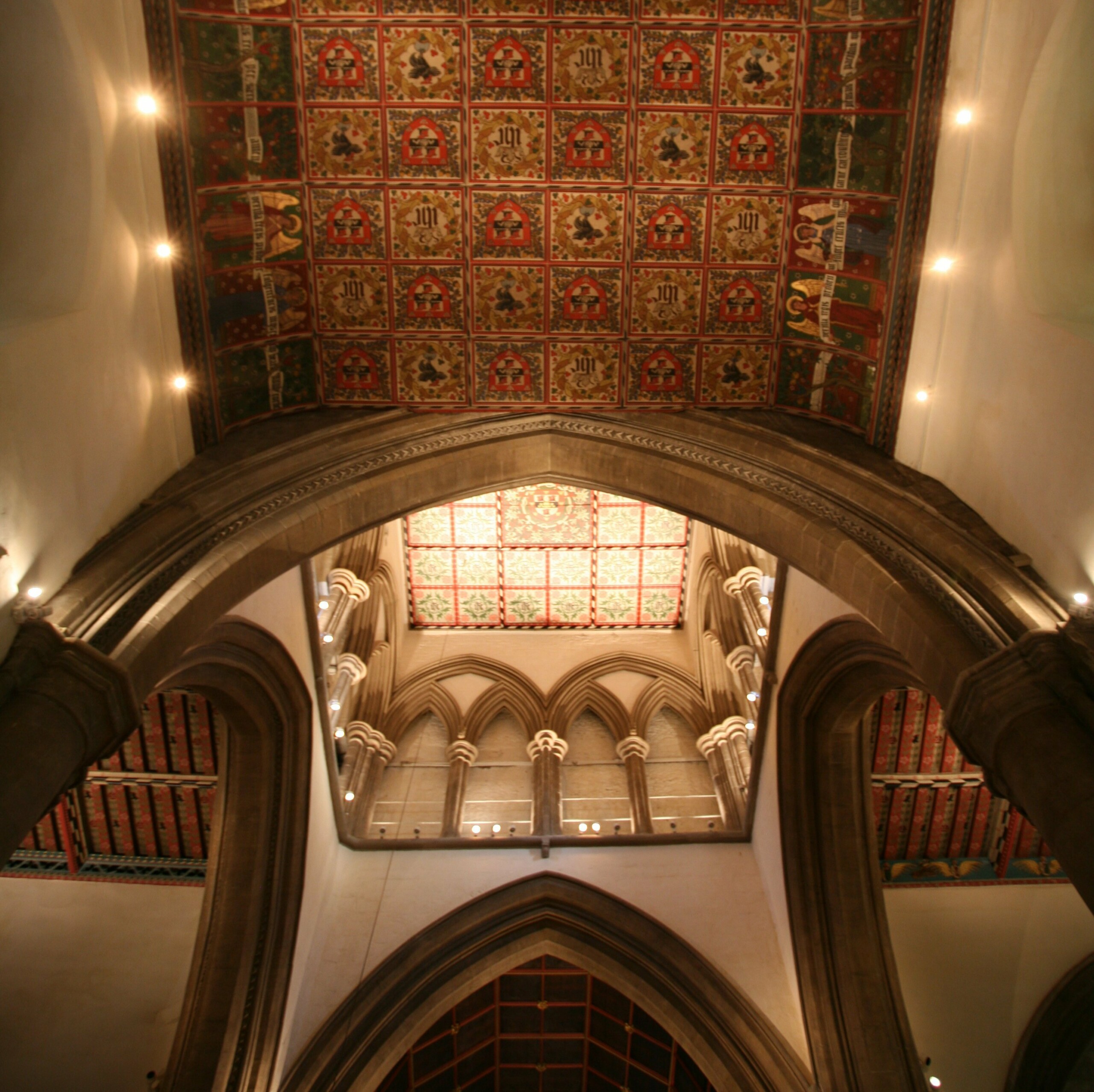 The decorative ceilings designed and executed by Morris working under Bodley are still in need of conservation, but are shown to better advantage by the new lighting.